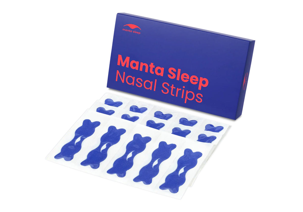 Blue Manta Sleep Nasal Strips package displayed above a clear sheet with ten dark blue nasal strips on white surface.